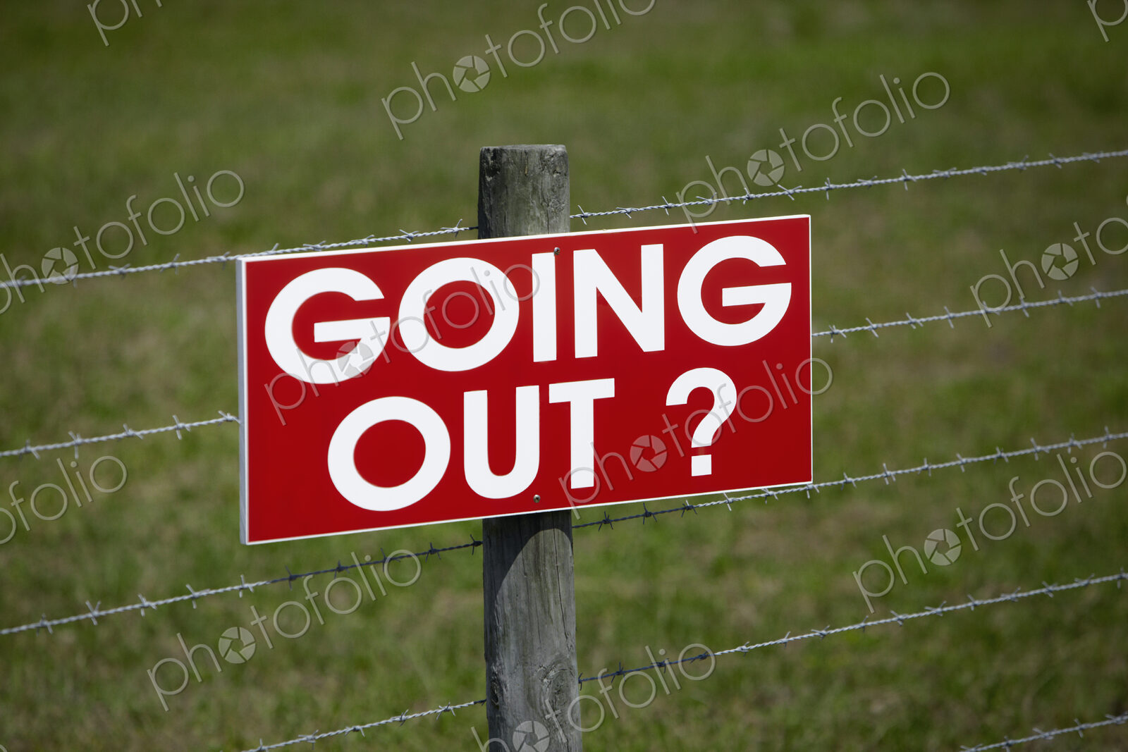 Sign on a Barbwire Fence
