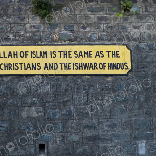 Sign on the wall, message of equality between faiths, on the Kalka-Shimla railway