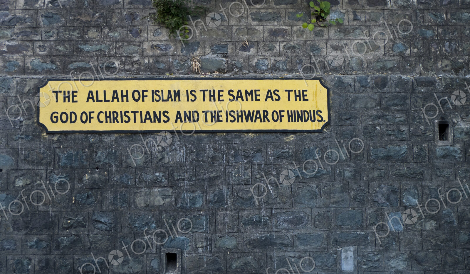 Sign on the wall, message of equality between faiths, on the Kalka-Shimla railway