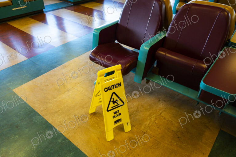 Sign warning of slippery floors, Seattle, WA USA