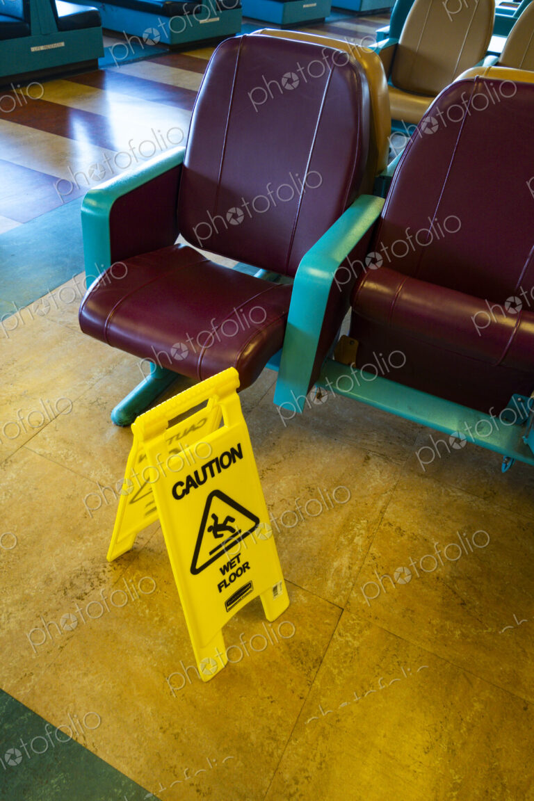 Sign warning of slippery floors, Seattle, WA USA