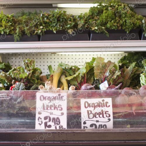 Signs in an organic produce display fridge. Signs in an organic produce display fridge.