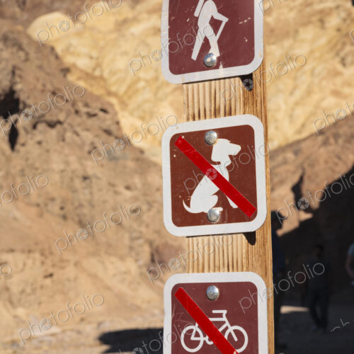Signs on a walking trail in a national park. No Dogs and No Bicycles. Signs on a walking trail in a national park. No Dogs and No Bicycles.