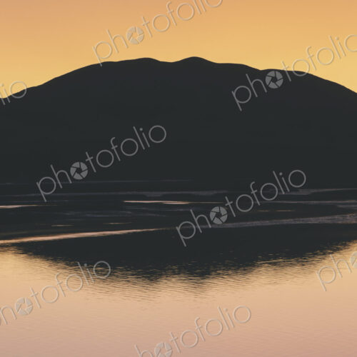 Silhouette of Black Mountain at dawn, Tamales Bay in foreground, Point Reyes National… Silhouette of Black Mountain at dawn, Tamales Bay in foreground, Point Reyes National…