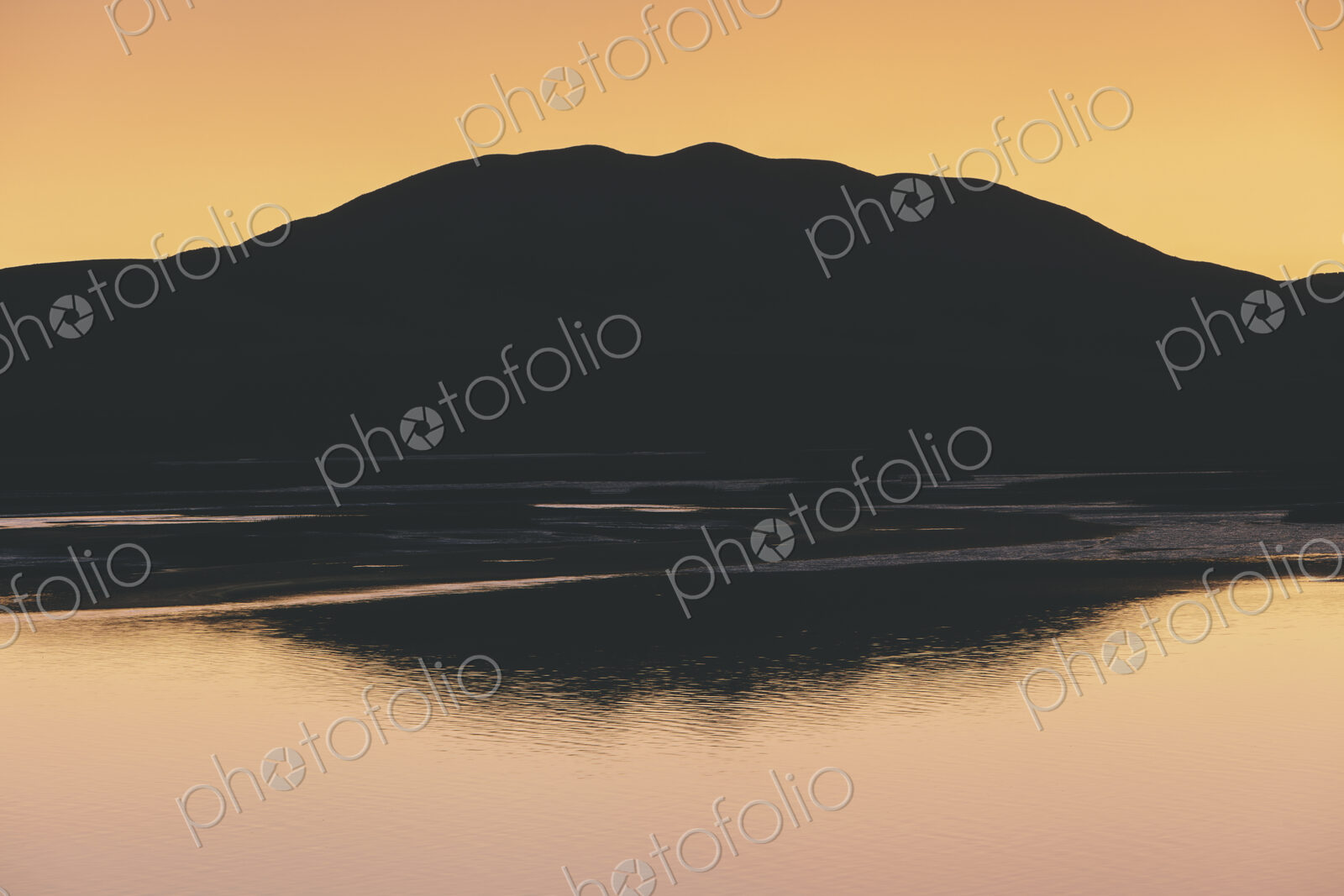 Silhouette of Black Mountain at dawn, Tamales Bay in foreground, Point Reyes National…