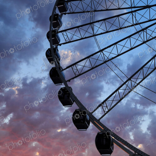 Silhouette of Great Seattle Wheel under sunset sky, Seattle, Washington, United States Silhouette of Great Seattle Wheel under sunset sky, Seattle, Washington, United States