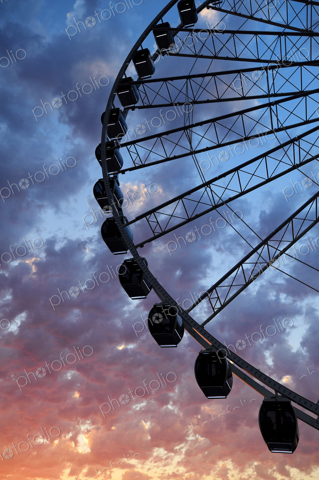 Silhouette of Great Seattle Wheel under sunset sky, Seattle, Washington, United States