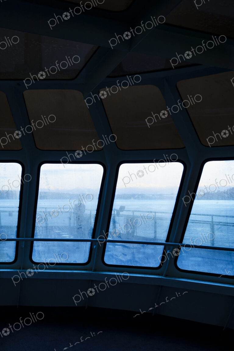 Silhouette of person through foggy window on Puget Sound ferry, WA USA
