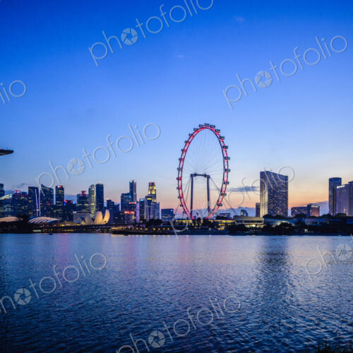 Singapore city skyline under sunset sky, Singapore, Singapore Singapore city skyline under sunset sky, Singapore, Singapore