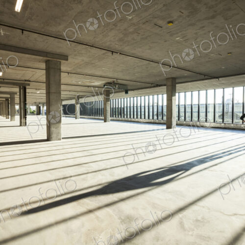 Single businessman in new empty raw business space for a new office Single businessman in new empty raw business space for a new office