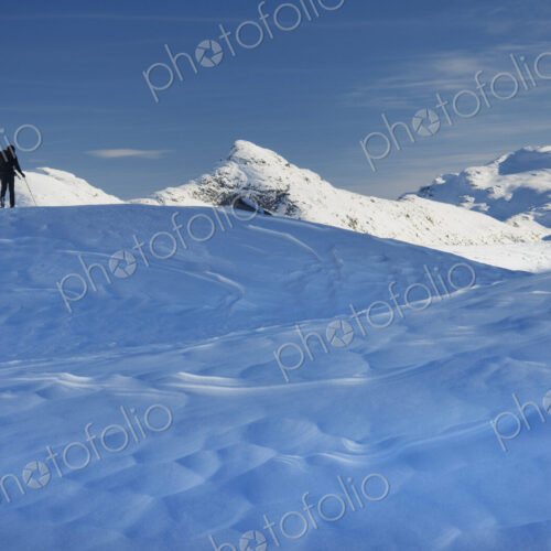 Skier on the snow, backcountry skiing, in deep snow.