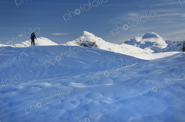 Skier on the snow, backcountry skiing, in deep snow.