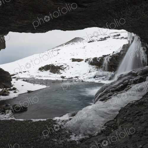 Skógafoss waterfall on the Skoga river, a cascade flowing into the river, view from a… Skógafoss waterfall on the Skoga river, a cascade flowing into the river, view from a…
