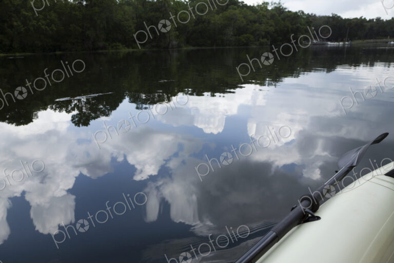 Sky And Clouds Reflected In River