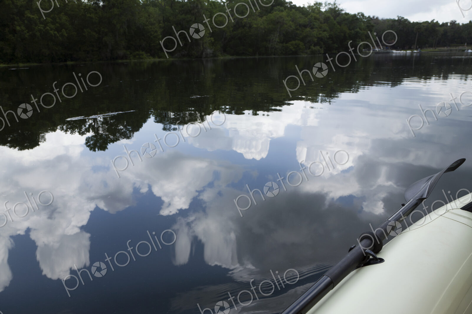 Sky And Clouds Reflected In River