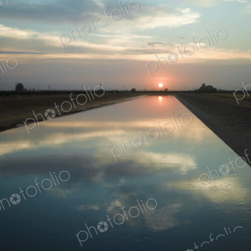 Sky reflected in a Canal at Sunset Sky reflected in a Canal at Sunset