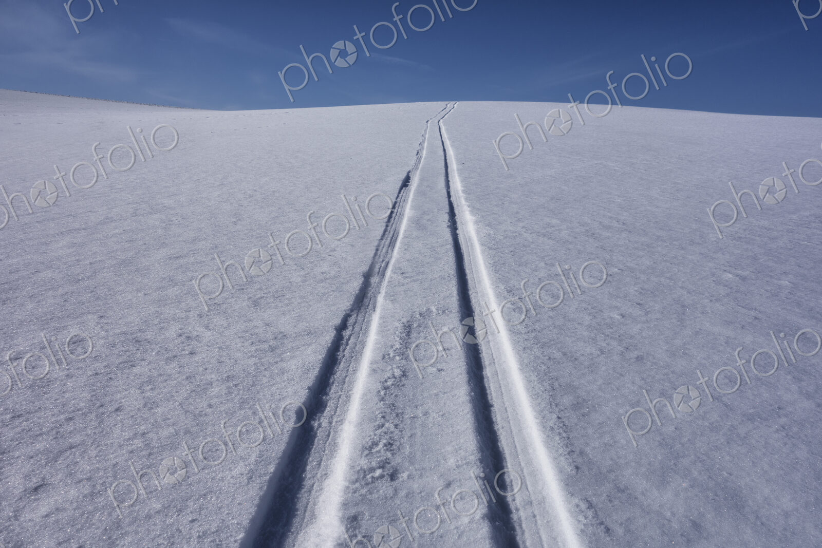 Sled tracks on snow.
