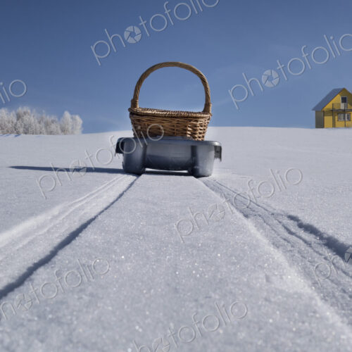 Sled transporting basket over hilly snowy winter landscape, Estonia