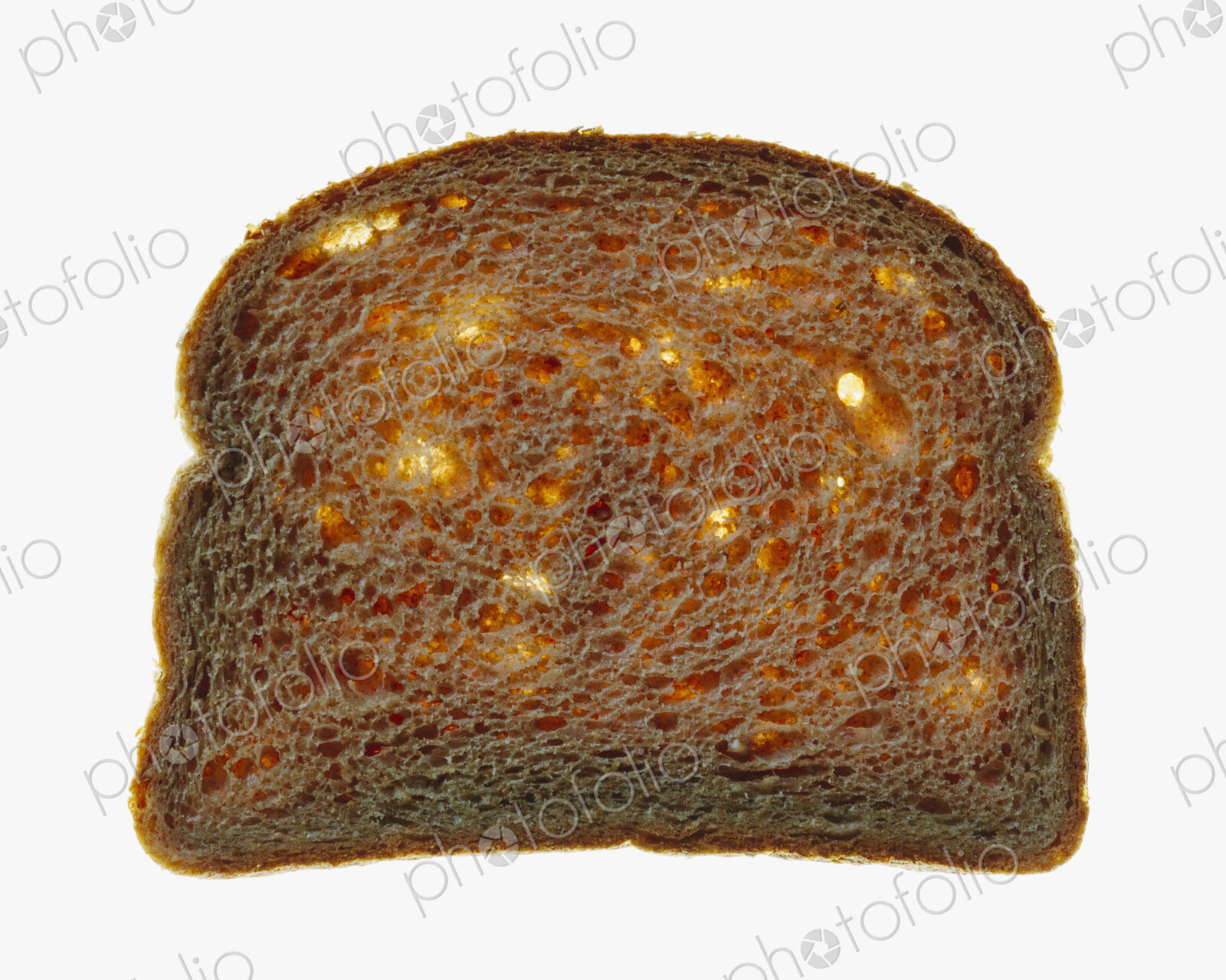 Slice of organic whole wheat bread on a white background