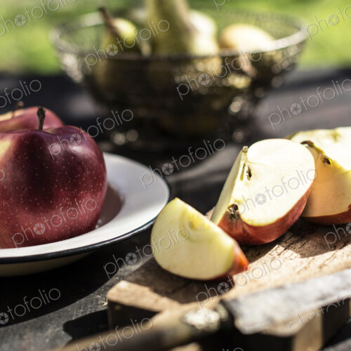 Sliced apple on outdoor table Sliced apple on outdoor table