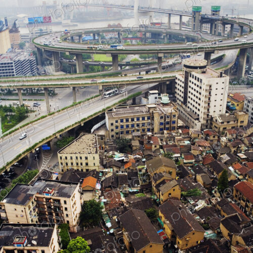 Slum Housing with Nanpu Bridge in Background