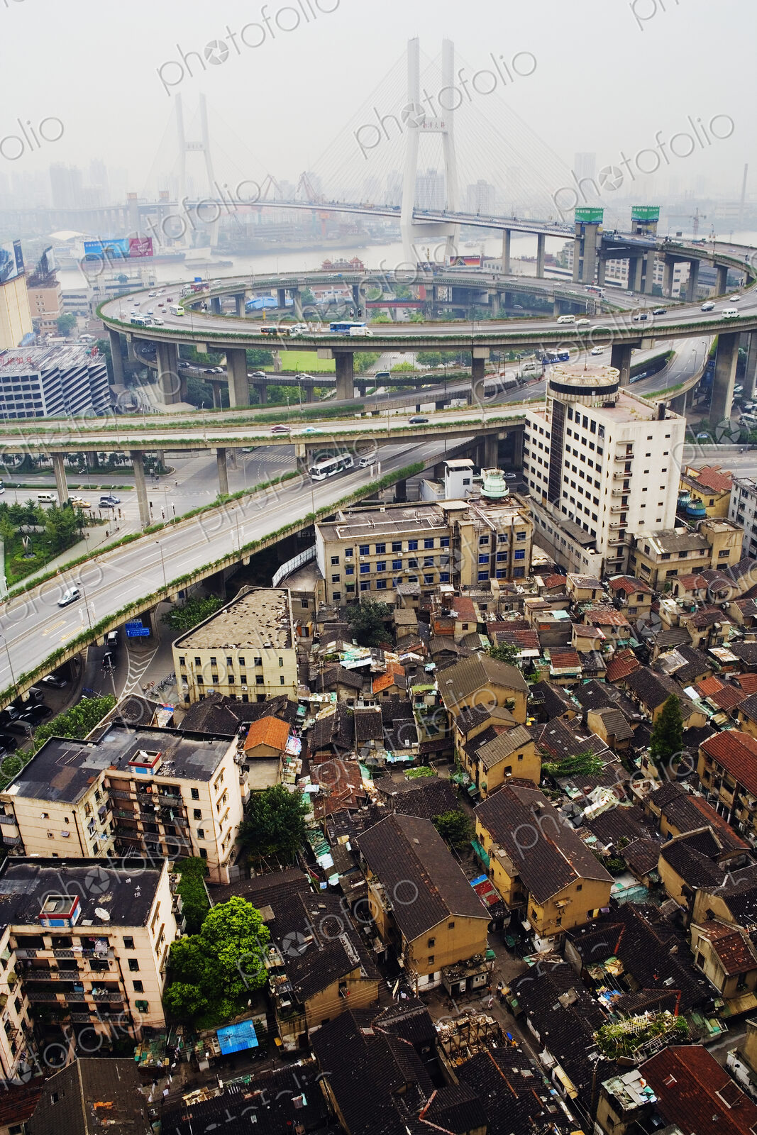 Slum Housing with Nanpu Bridge in Background