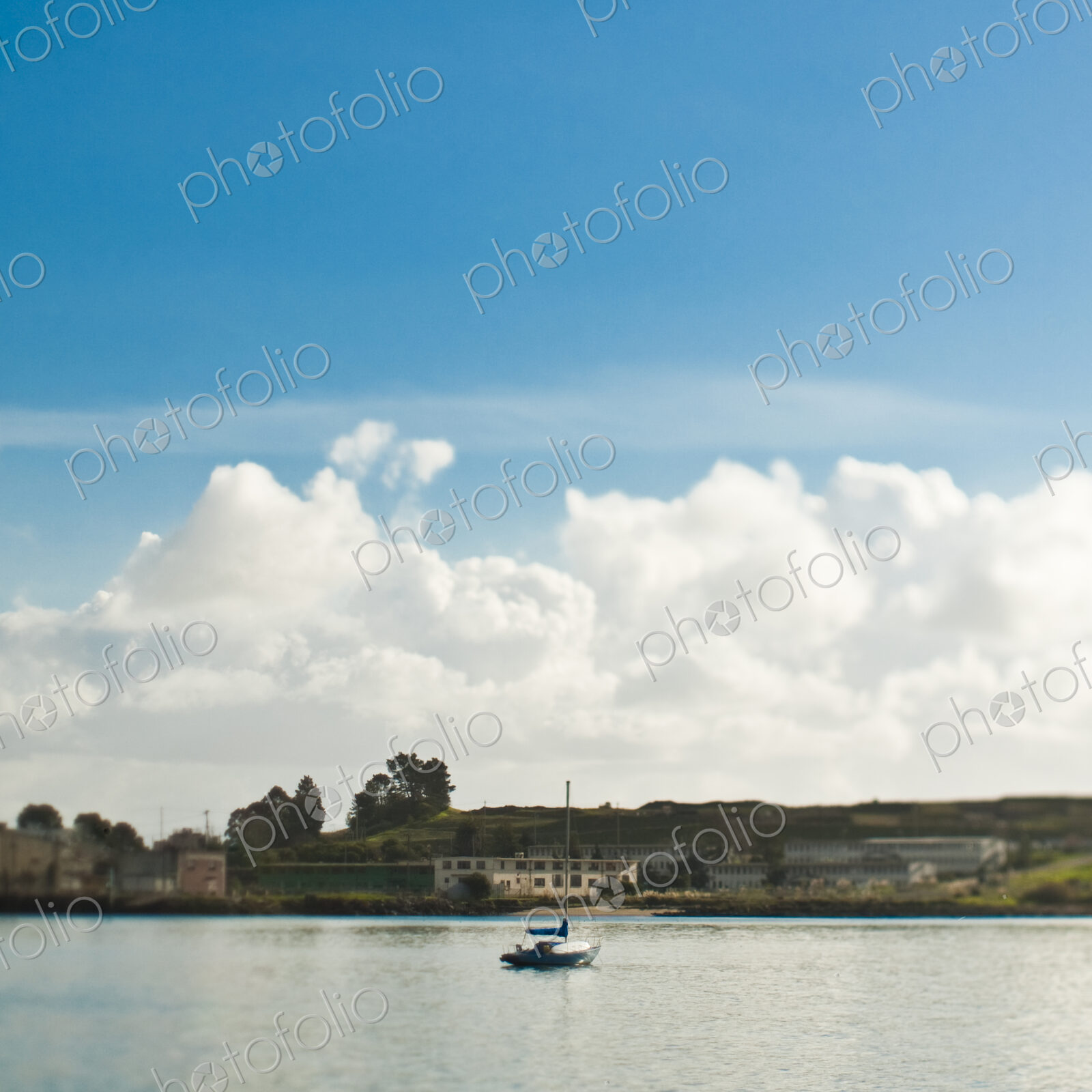 Small Sailboat Anchored in Bay