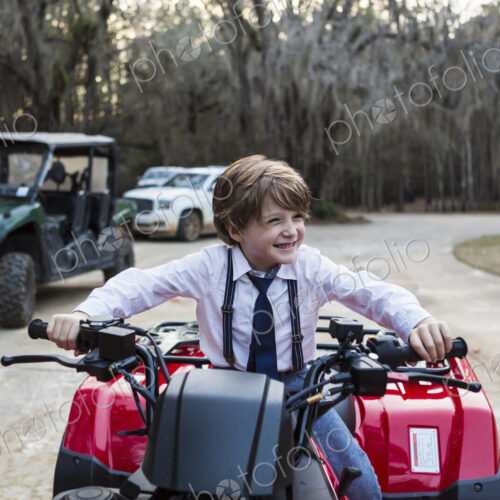 Smiling 6 year old boy on ATV, Georgia Smiling 6 year old boy on ATV, Georgia