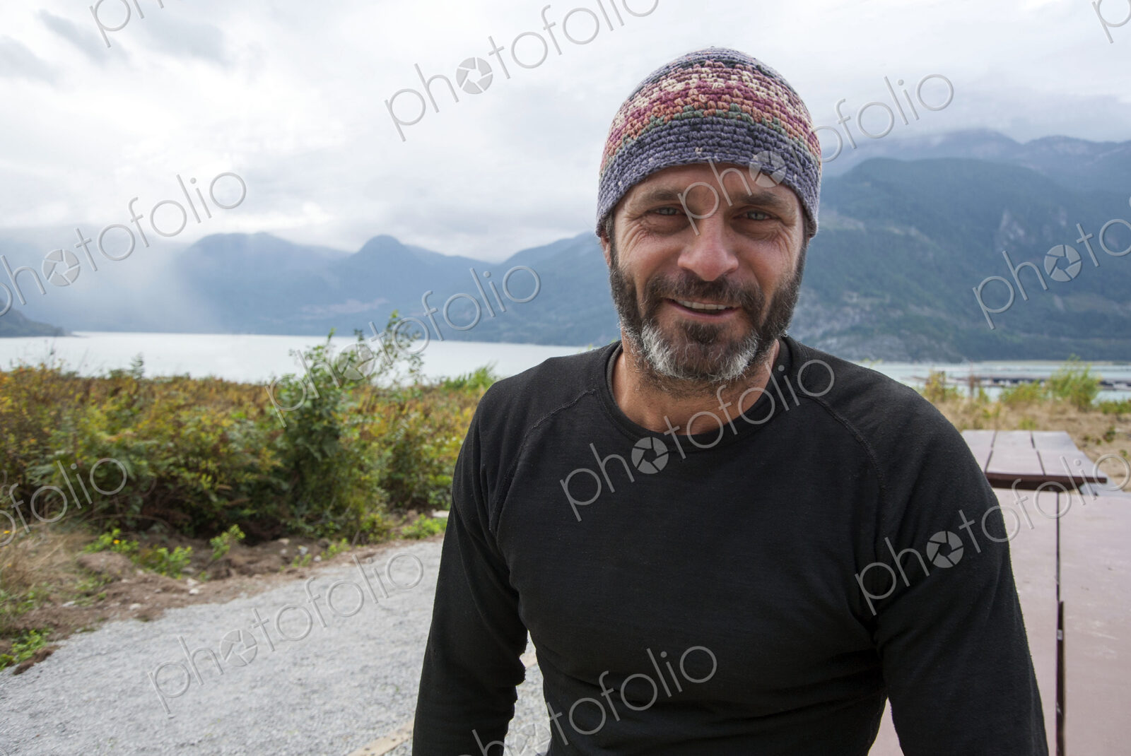 Smiling man wearing beanie hat outdoors