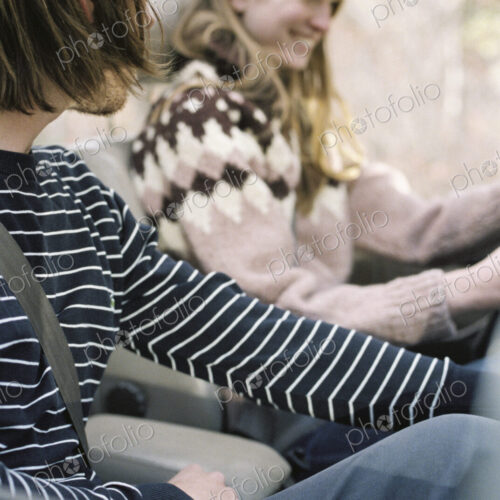 Smiling young couple driving in their car. Smiling young couple driving in their car.