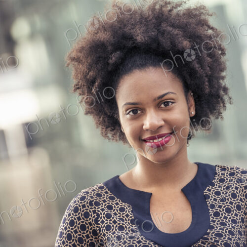 Smiling young woman in a dress with keyhole neckline Smiling young woman in a dress with keyhole neckline
