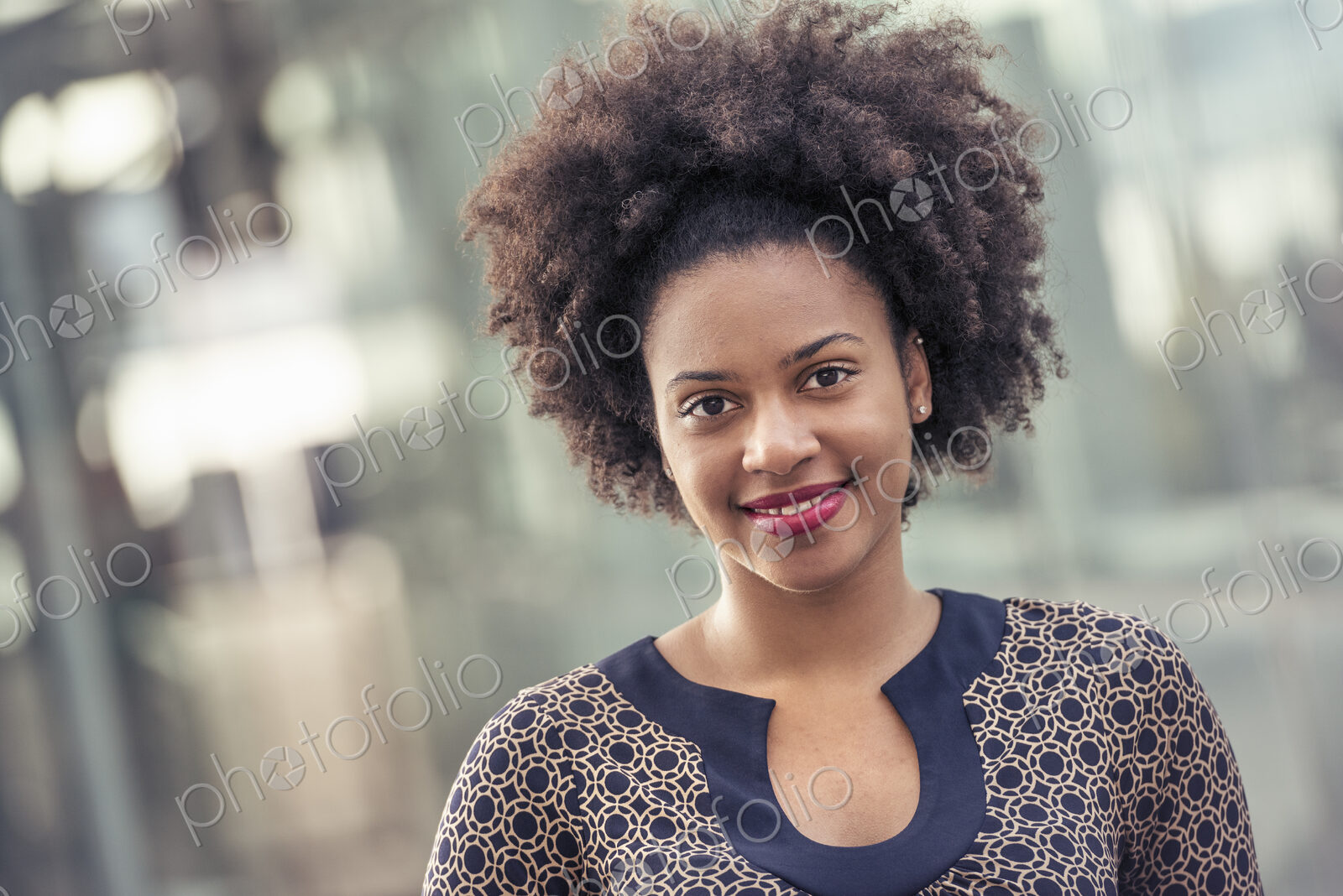 Smiling young woman in a dress with keyhole neckline