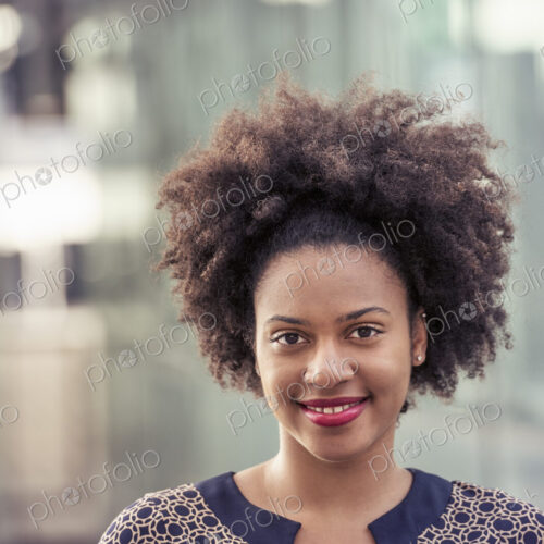 Smiling young woman in a dress with keyhole neckline Smiling young woman in a dress with keyhole neckline
