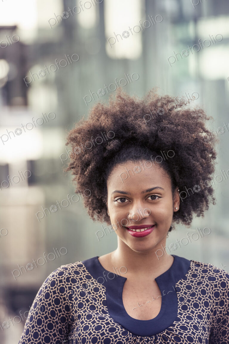 Smiling young woman in a dress with keyhole neckline