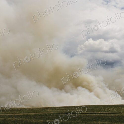Smoke from controlled burn on farmland, seasonal burns to clear stubble.