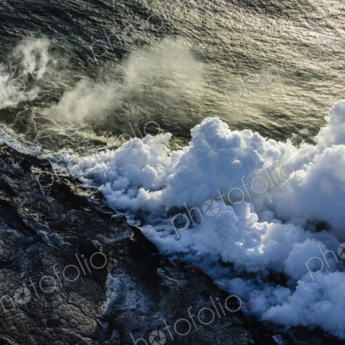 Smoke from lava near ocean Smoke from lava near ocean