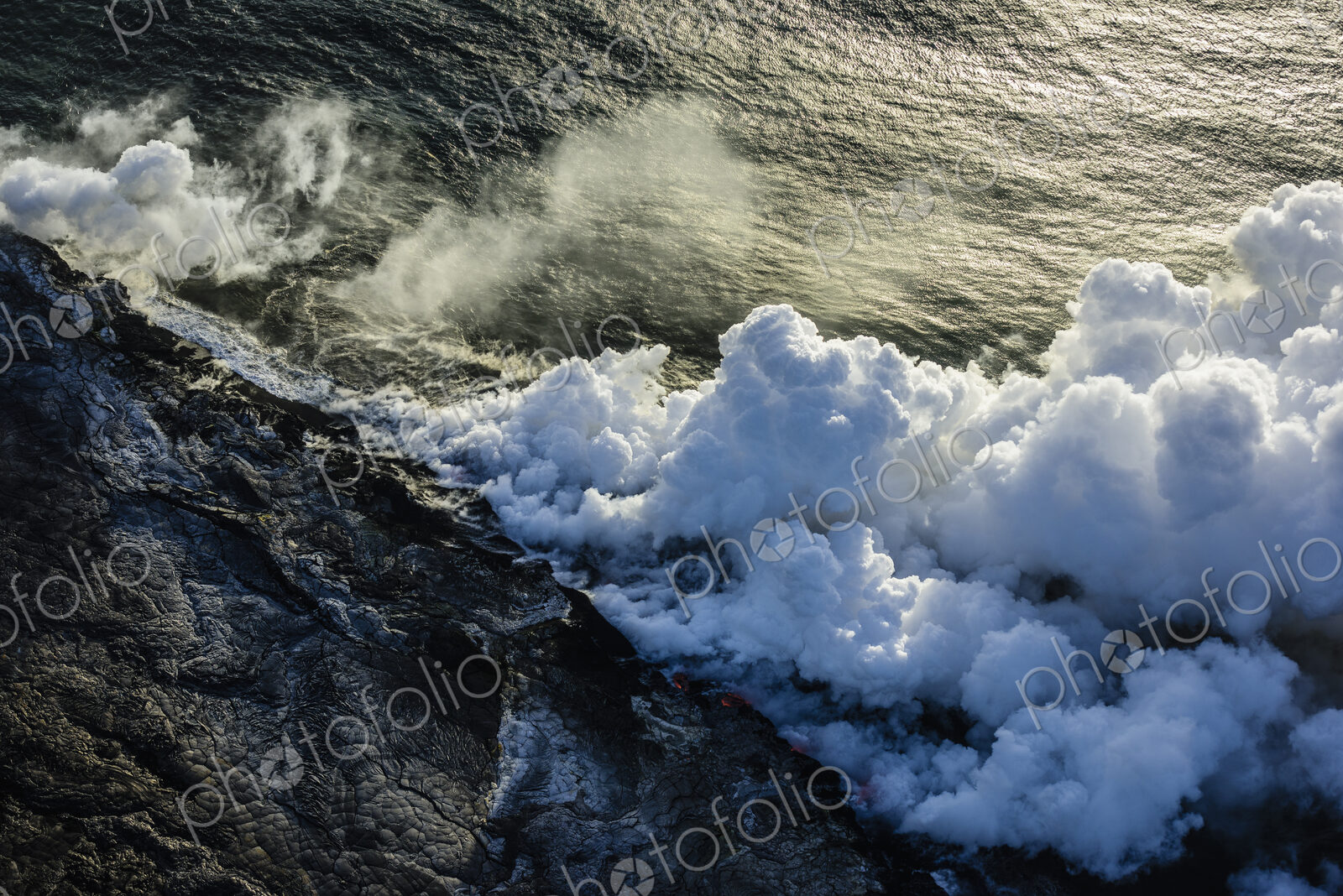 Smoke from lava near ocean