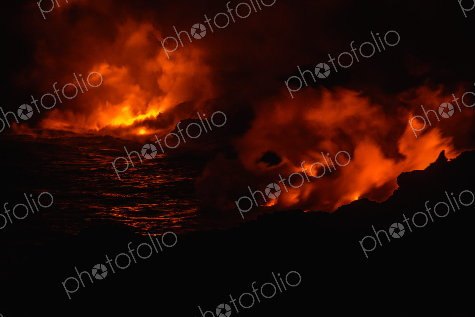 Smoke from molten lava at night