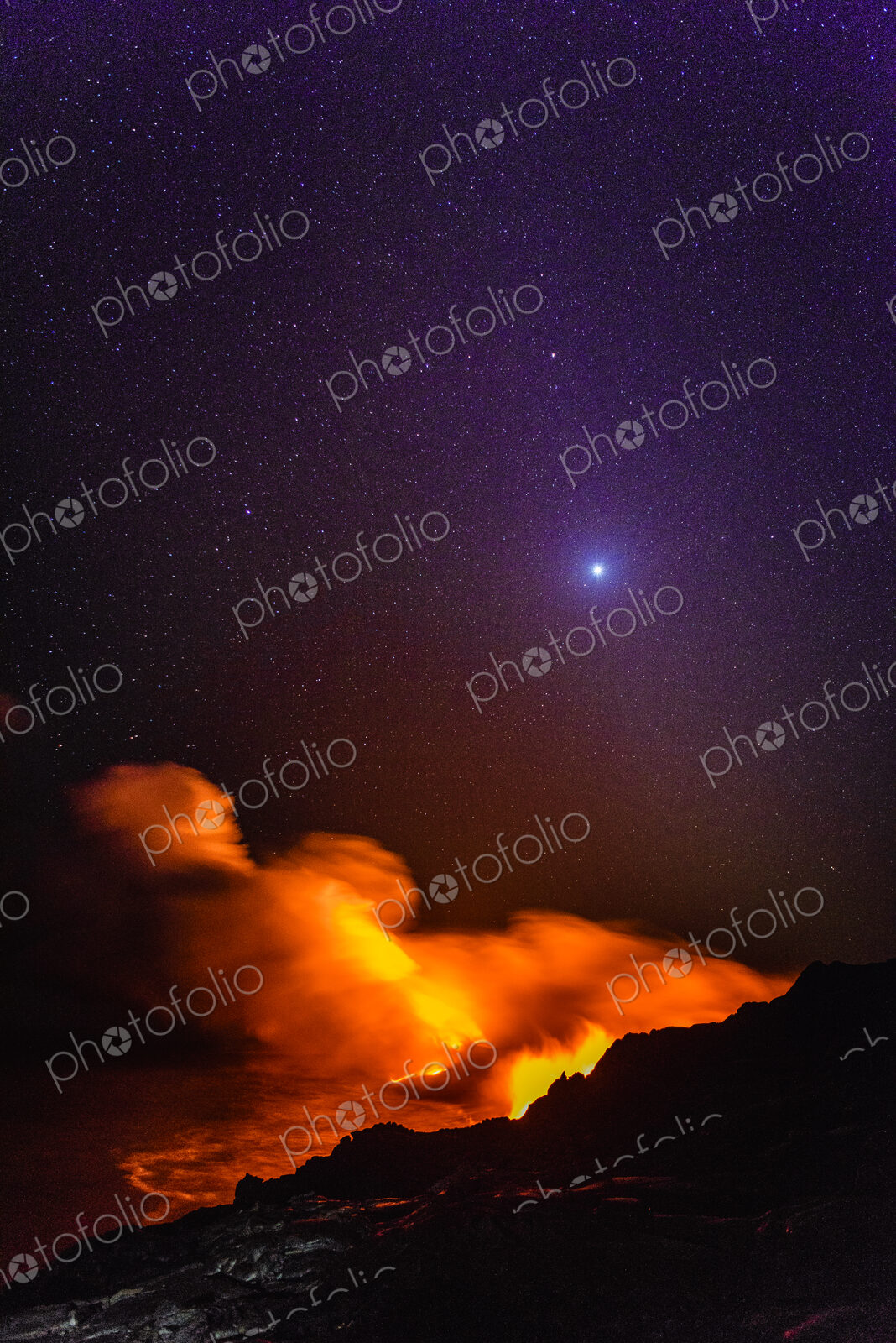 Smoke from molten lava at night