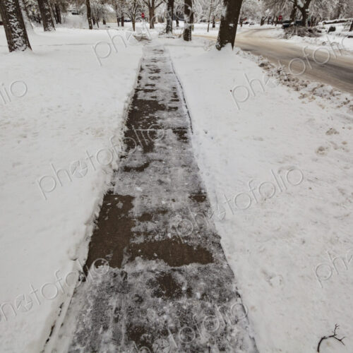 Snow and ice covered sidewalk, Spokane, WA USA Snow and ice covered sidewalk, Spokane, WA USA