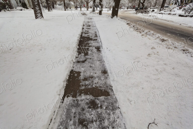 Snow and ice covered sidewalk, Spokane, WA USA