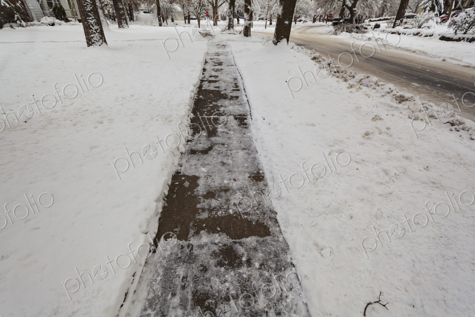 Snow and ice covered sidewalk, Spokane, WA USA