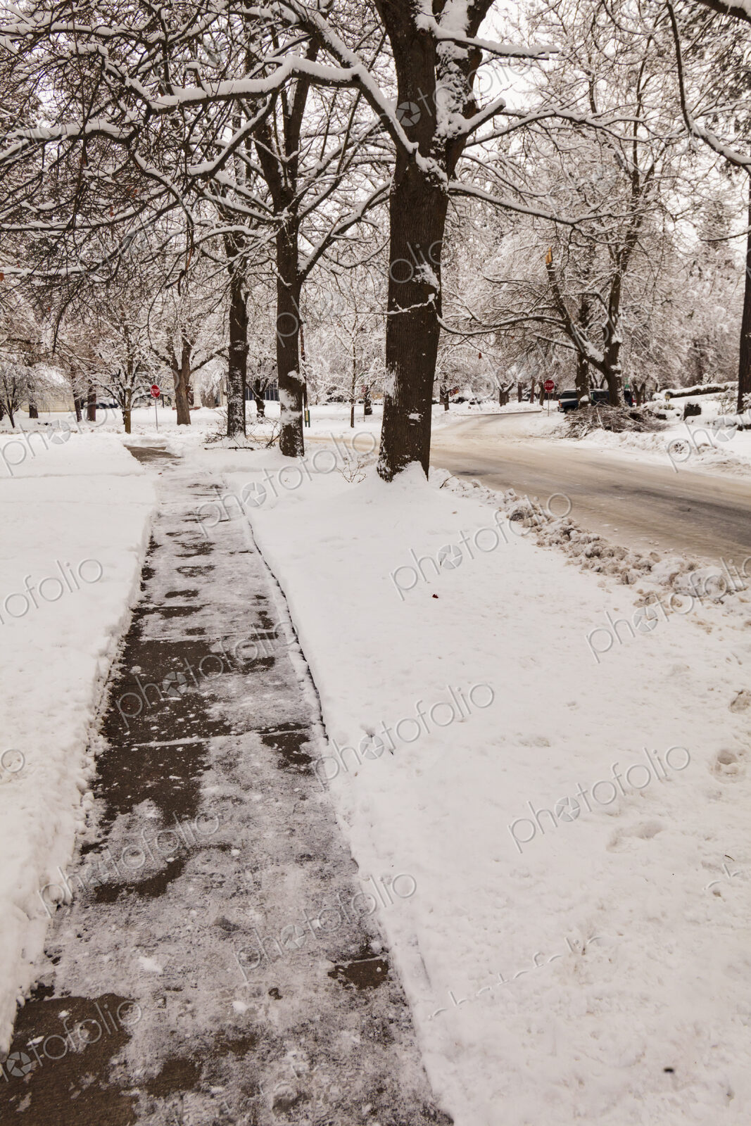 Snow and ice covered sidewalk, Spokane, WA USA