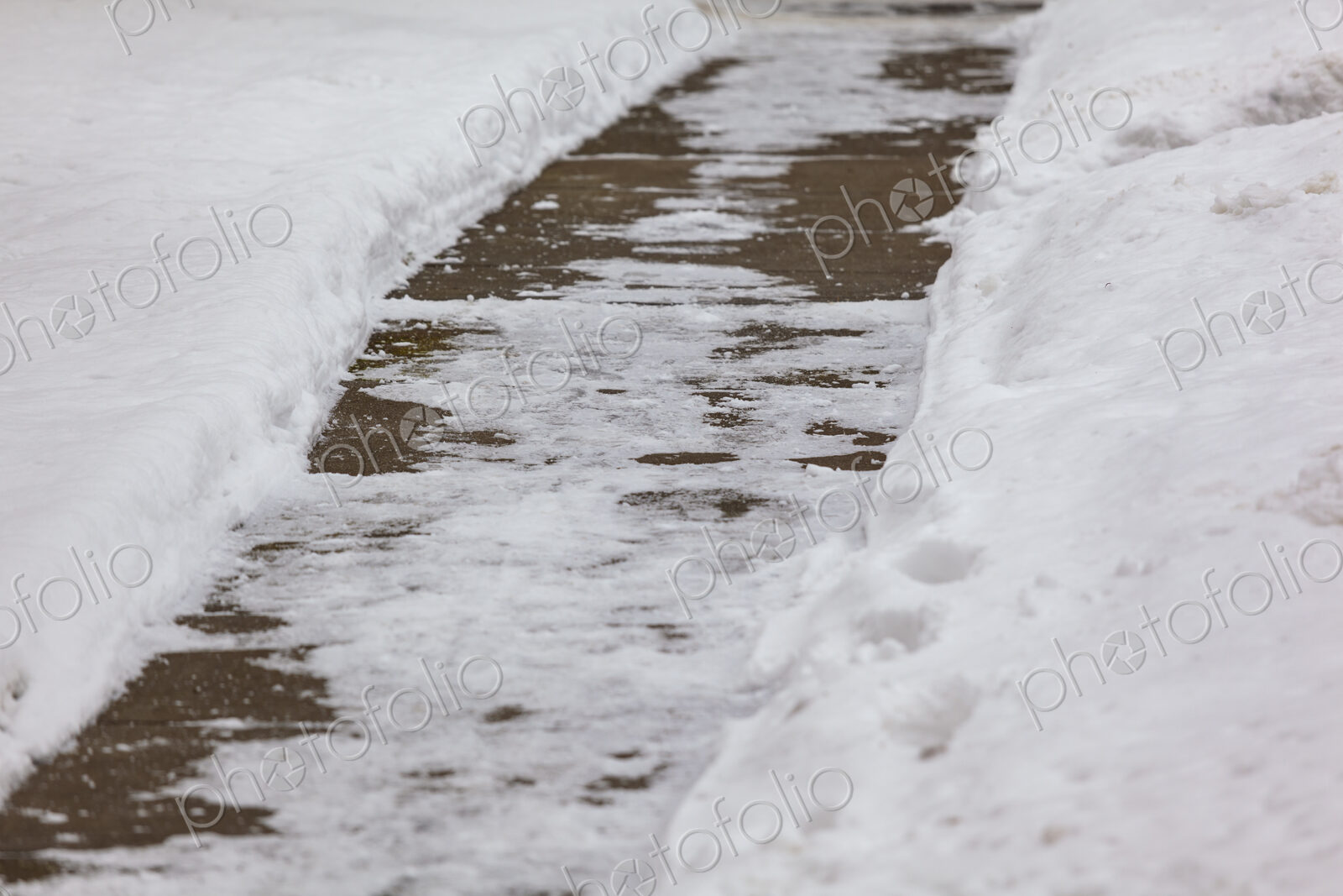 Snow and ice covered sidewalk, Spokane, WA USA