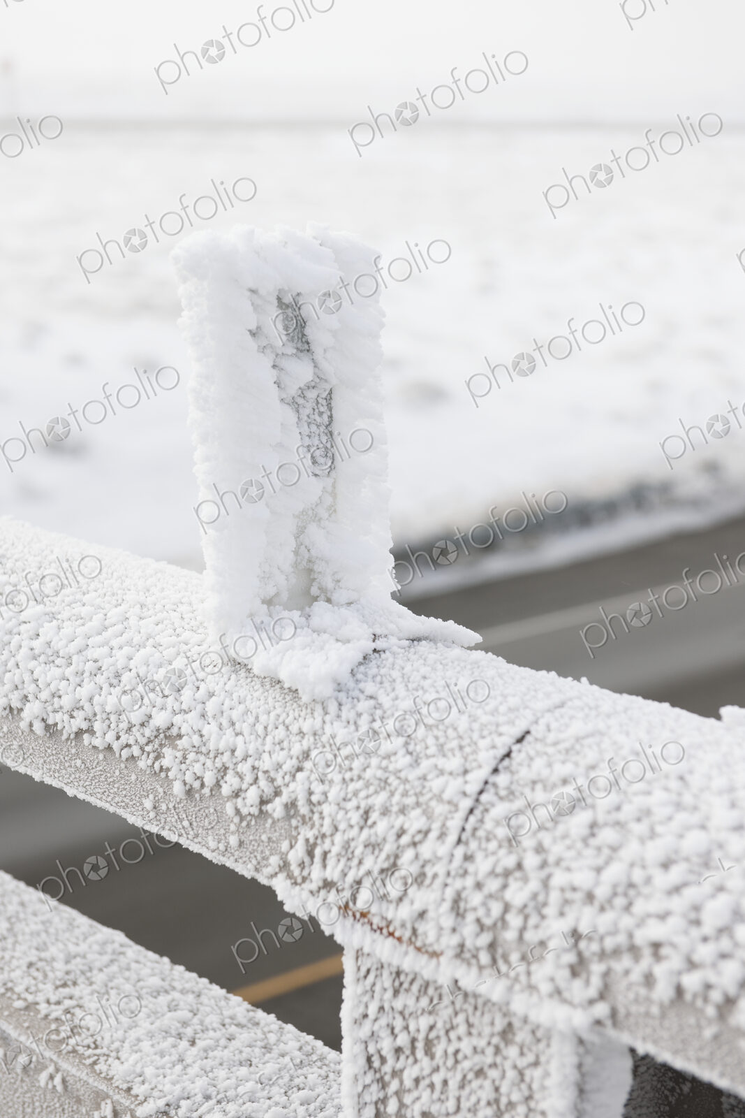 Snow on Bridge Railing