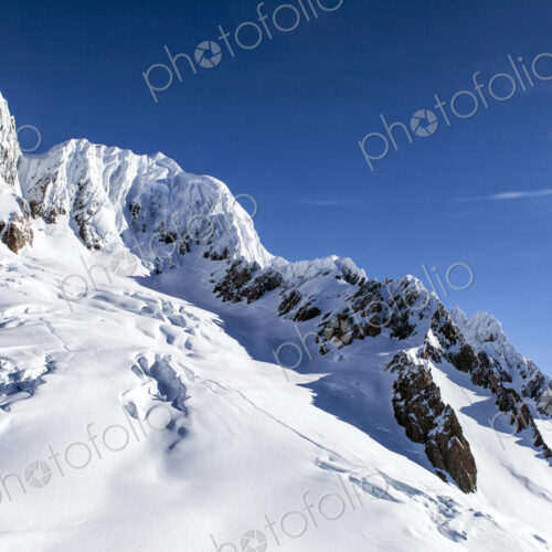 Snow on sunny mountain Snow on sunny mountain