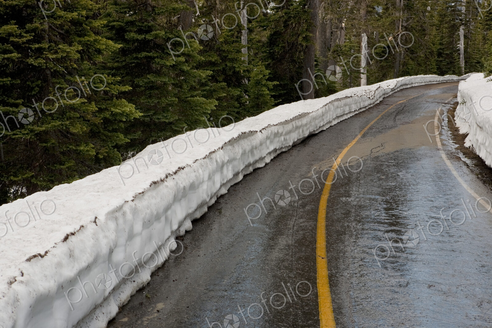 Snow piled up by rural road