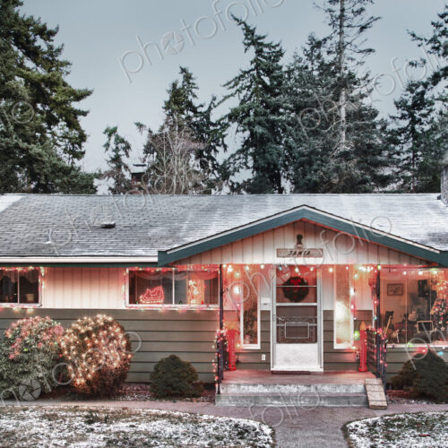 Snowy house with Christmas lights Snowy house with Christmas lights