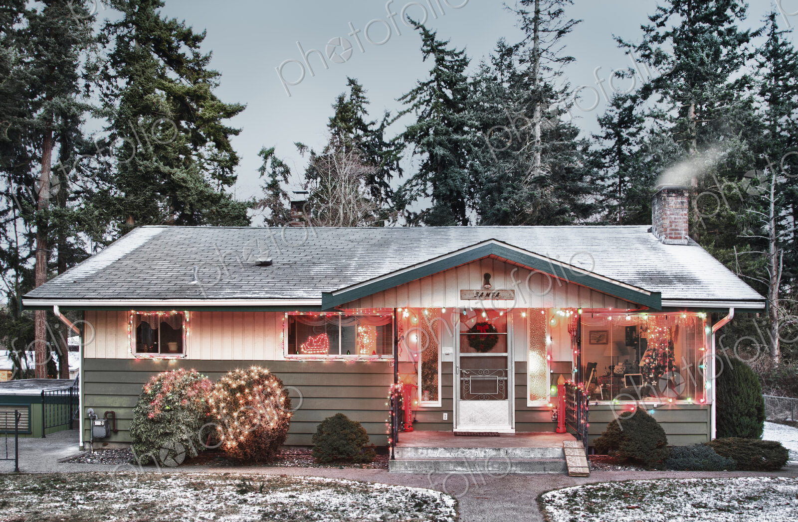 Snowy house with Christmas lights