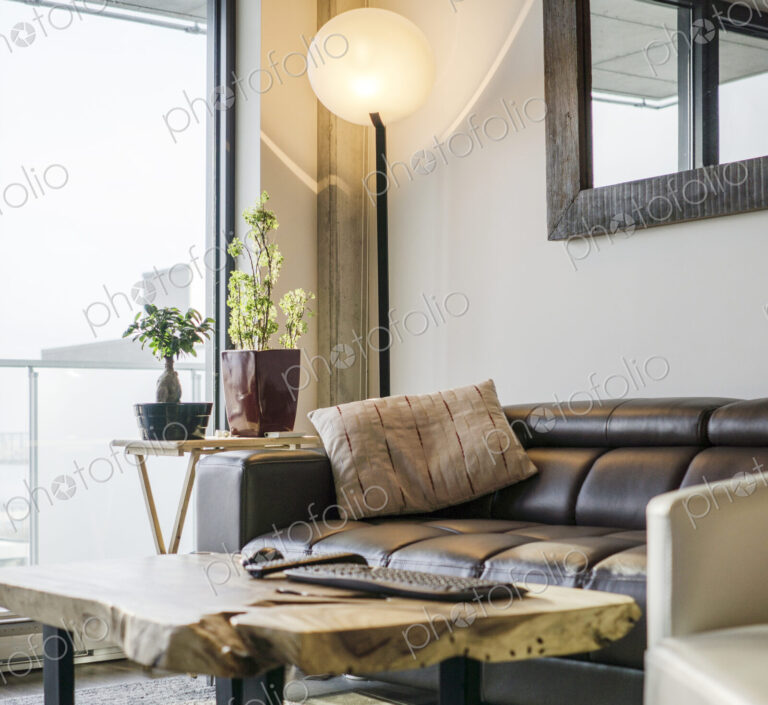 Sofa and armchair near livingroom window